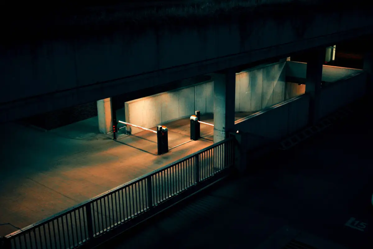 An automated vehicle entry lit at night