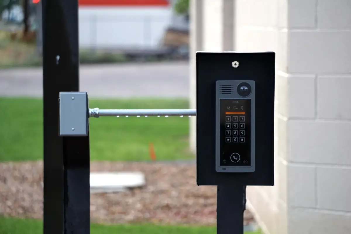 An outdoor intercom at a residential gate entrance