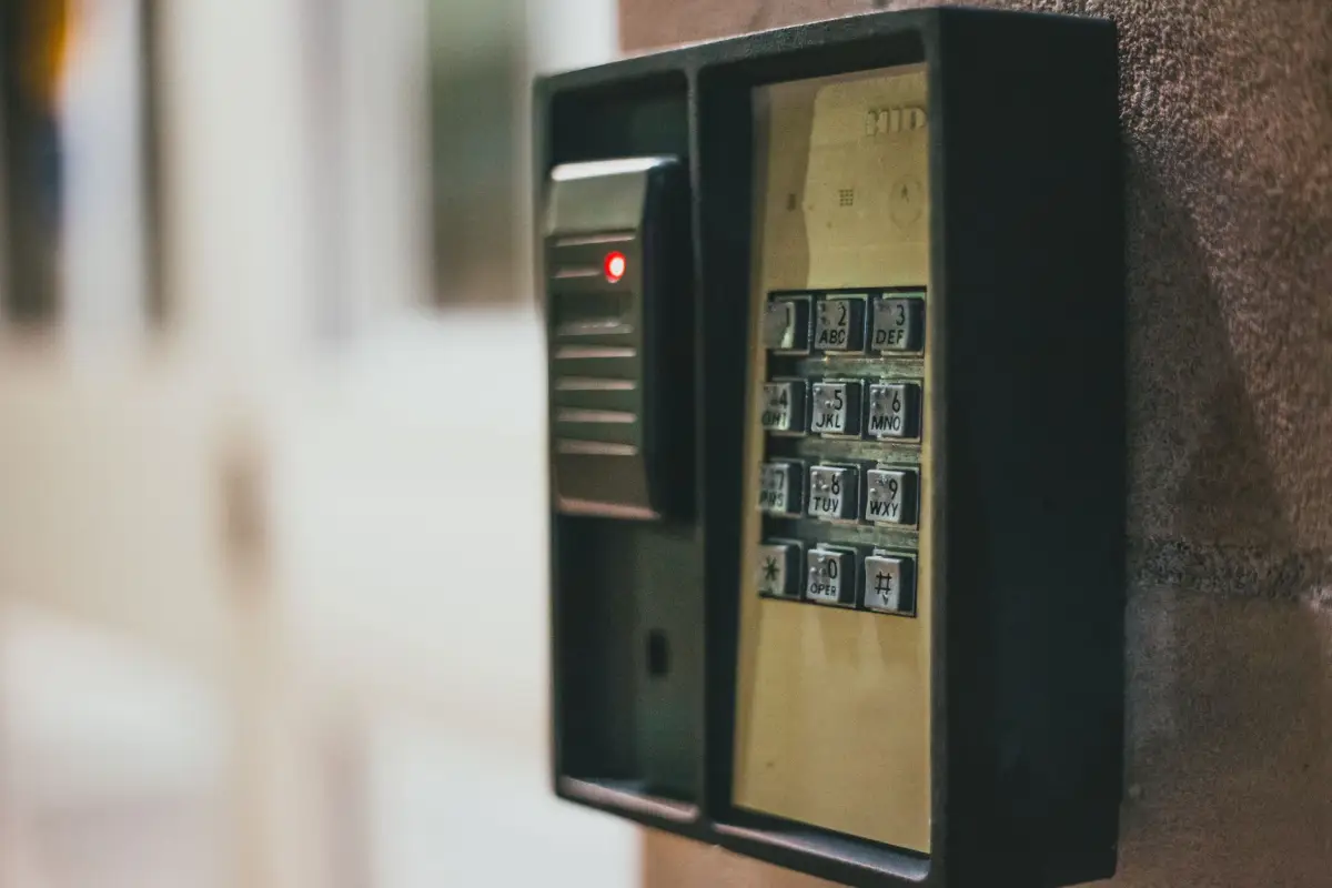 An access control keypad mounted beside a security gate