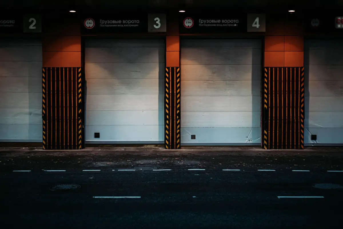 A sliding gate set across a paved entrance drive