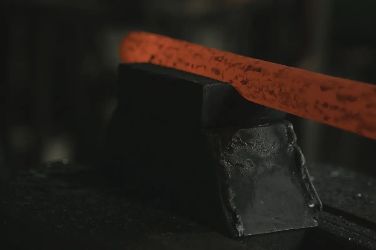Steel bar worked hot on an anvil in a forge
